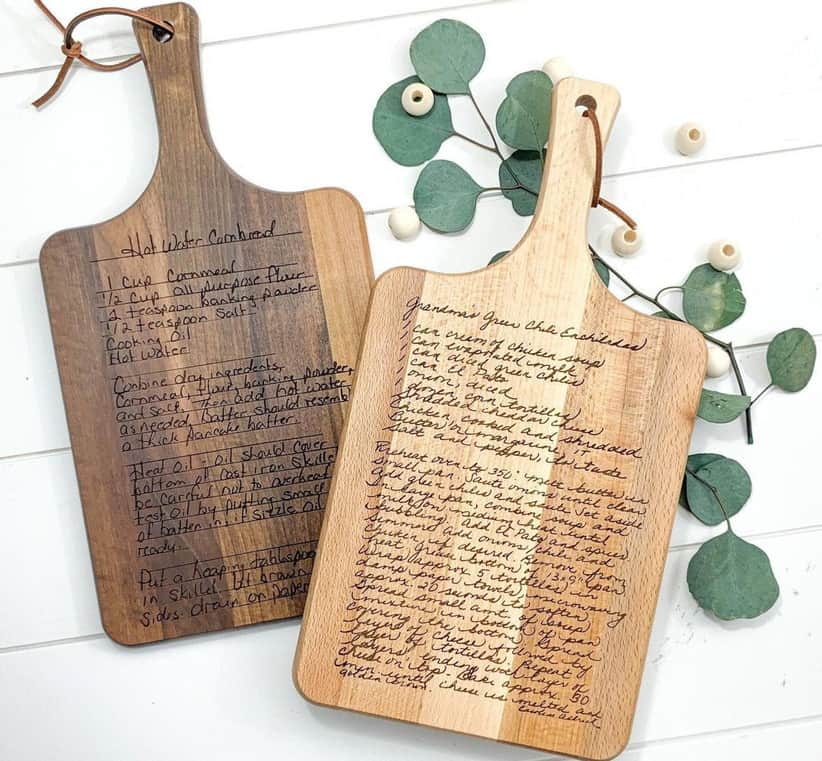 Two cutting boards with custom recipes printed on them.
